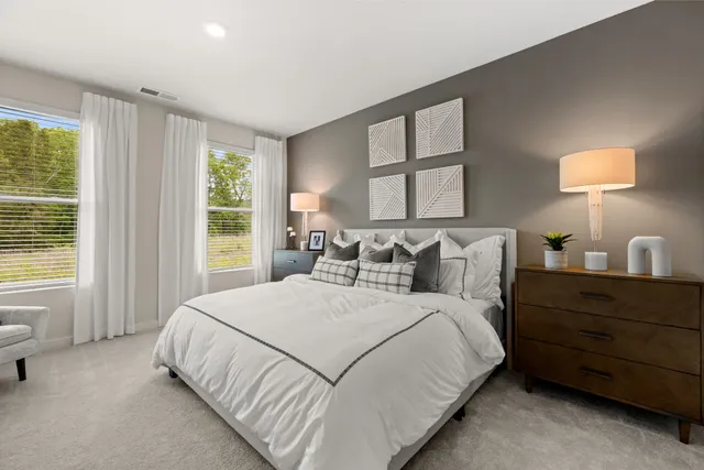 a bedroom with a bed and furniture