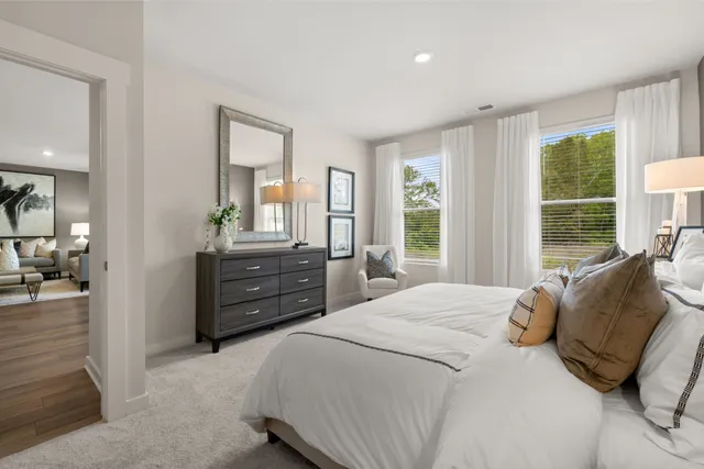 a bedroom with bed and window