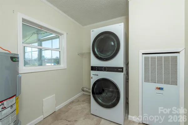 a view of a hallway with washer and dryer