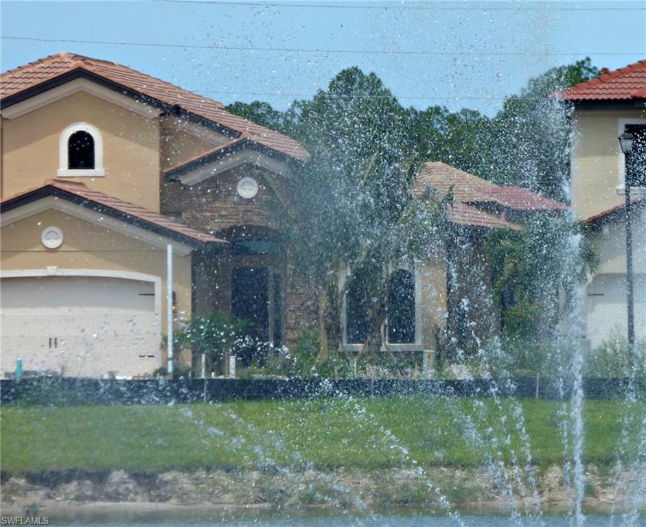 16211 Marsilea Place Naples, FL 34110 - Photo 17 of 25 a front view of a house with garden