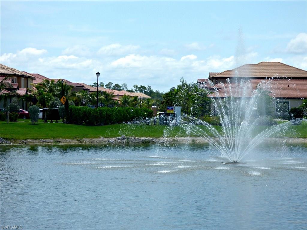 16211 Marsilea Place Naples, FL 34110 - Photo 20 of 25 a view of a house with a yard