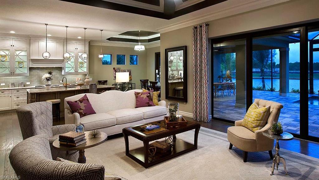 16211 Marsilea Place Naples, FL 34110 - Photo 4 of 25 a living room with furniture and a large window