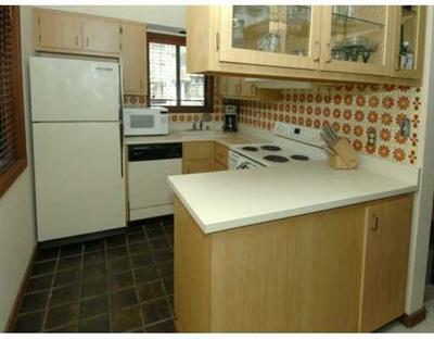 4770 Big Horn Road, Unit J3 Vail, CO 81657 - Photo 3 of 8 a kitchen with a sink a refrigerator and a stove