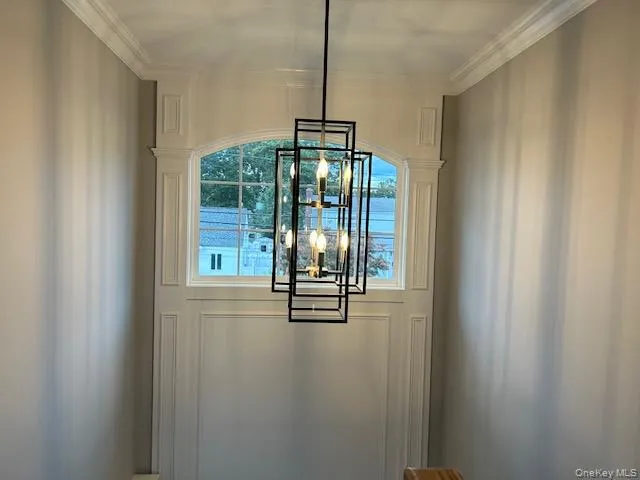 a kitchen with a sink a counter top space stainless steel appliances and cabinets