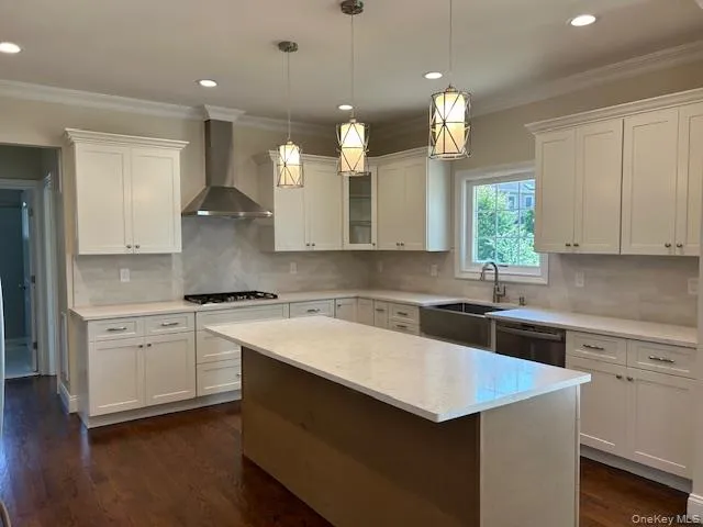 a kitchen with a sink a stove a microwave and cabinets