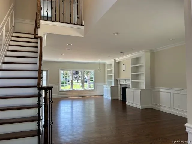 a view of an entryway with wooden floor