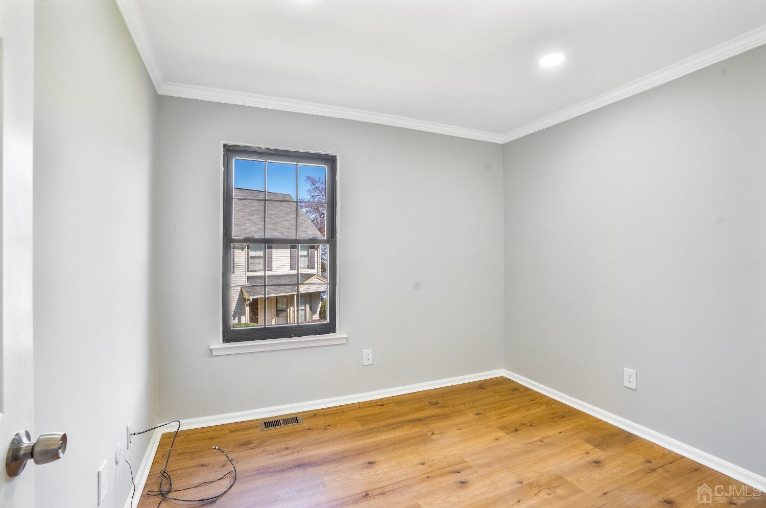 303 Timber Oaks Road Edison, NJ 08820 - Photo 16 of 28 a view of empty room with windows