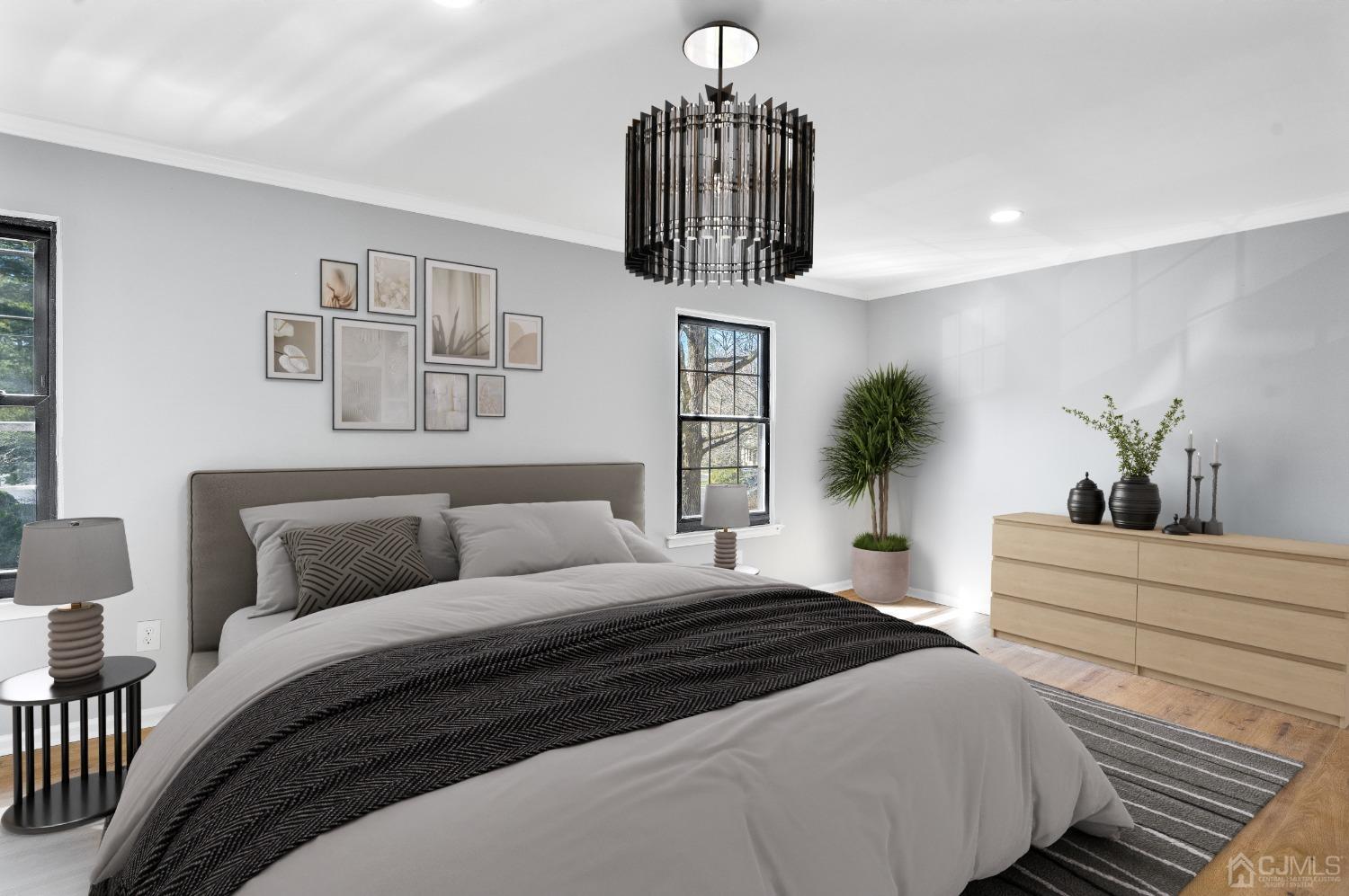303 Timber Oaks Road Edison, NJ 08820 - Photo 17 of 28 a bedroom with a large bed and a chandelier