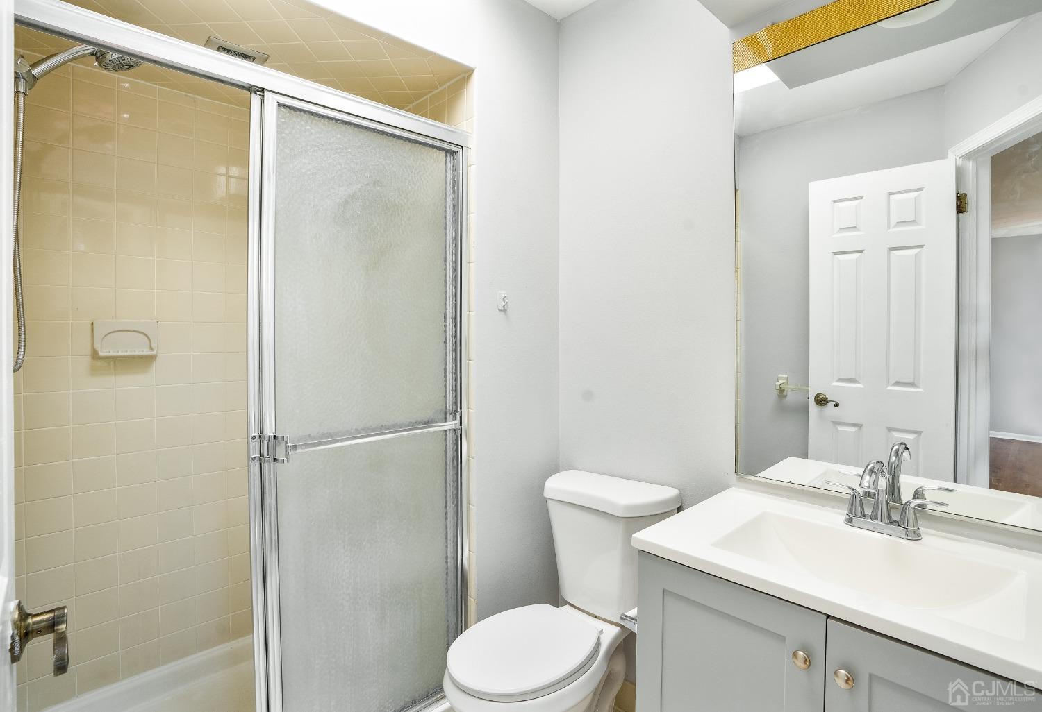 303 Timber Oaks Road Edison, NJ 08820 - Photo 23 of 28 a bathroom with a sink toilet and shower