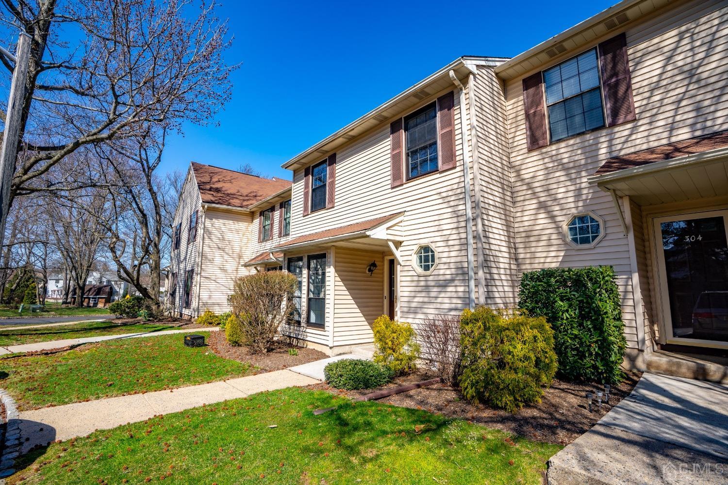 303 Timber Oaks Road Edison, NJ 08820 - Photo 26 of 28 a front view of a house with a yard