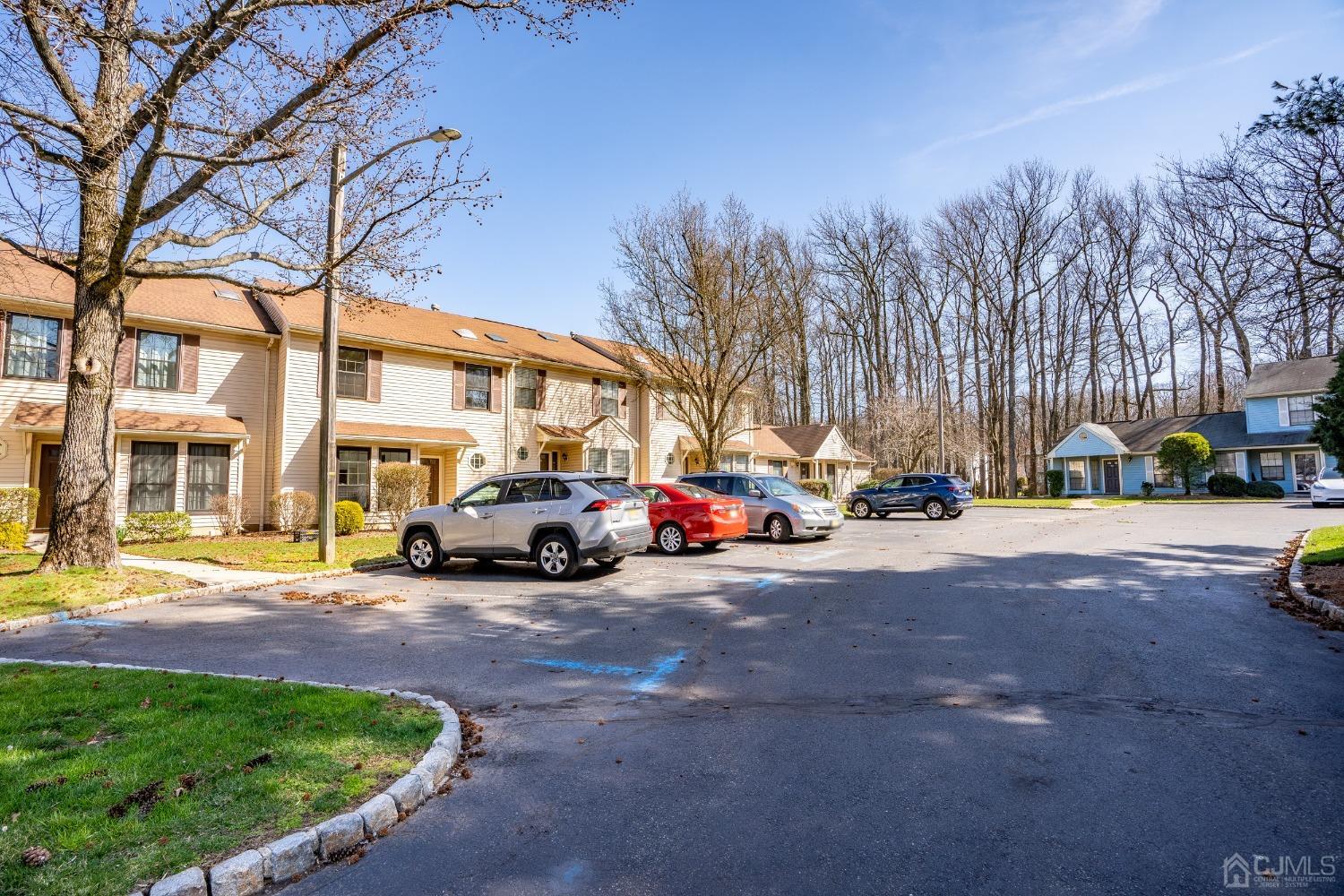 303 Timber Oaks Road Edison, NJ 08820 - Photo 28 of 28 a view of road with card parked on side and retail shops