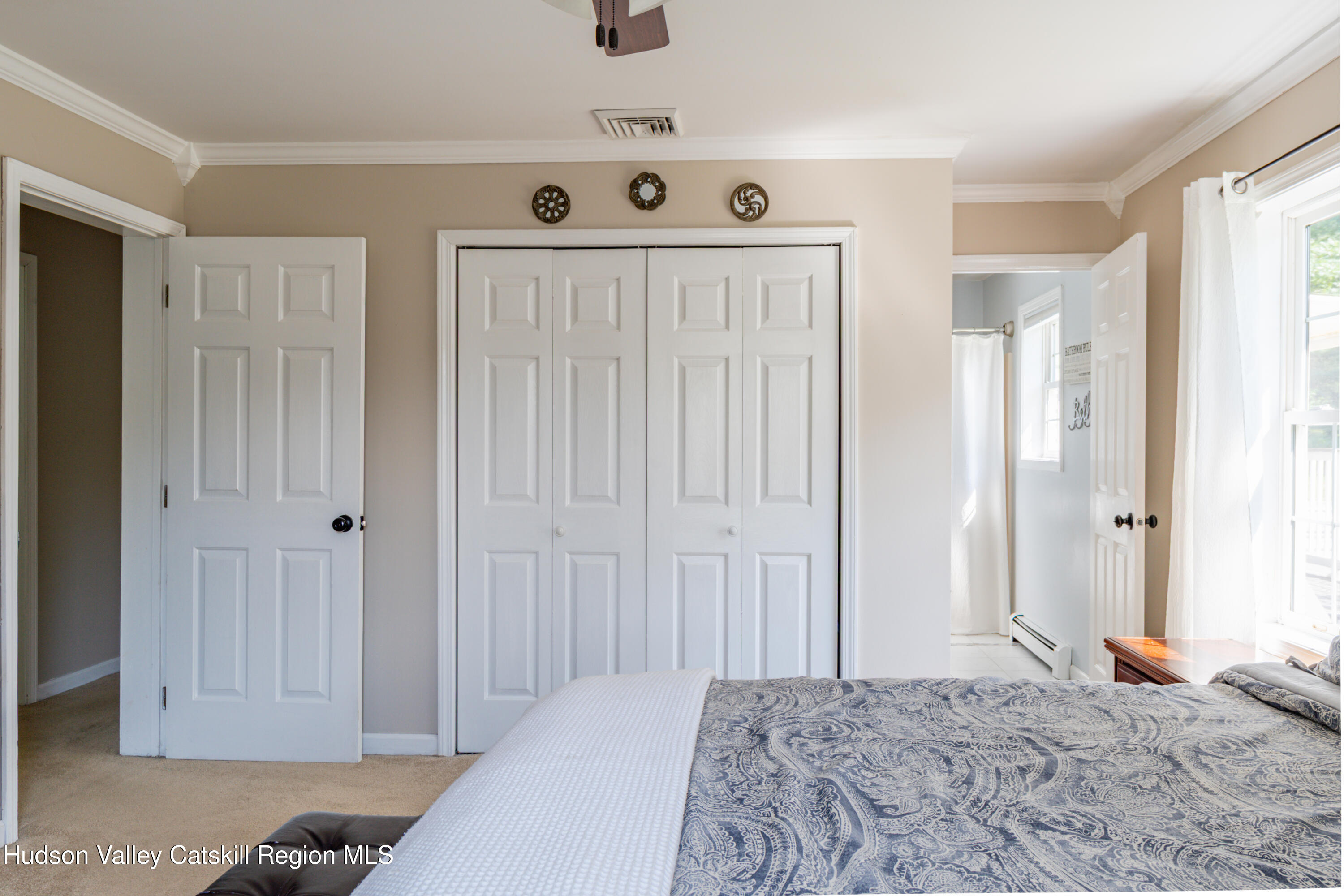 71 Duck Pond Road Stone Ridge, NY 12484 - Photo 14 of 35 a bedroom with a bed and a window