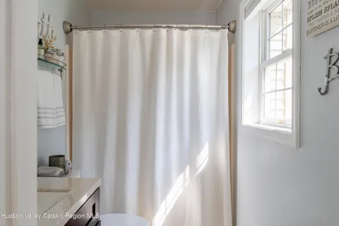a bathroom with a sink and a bath tub