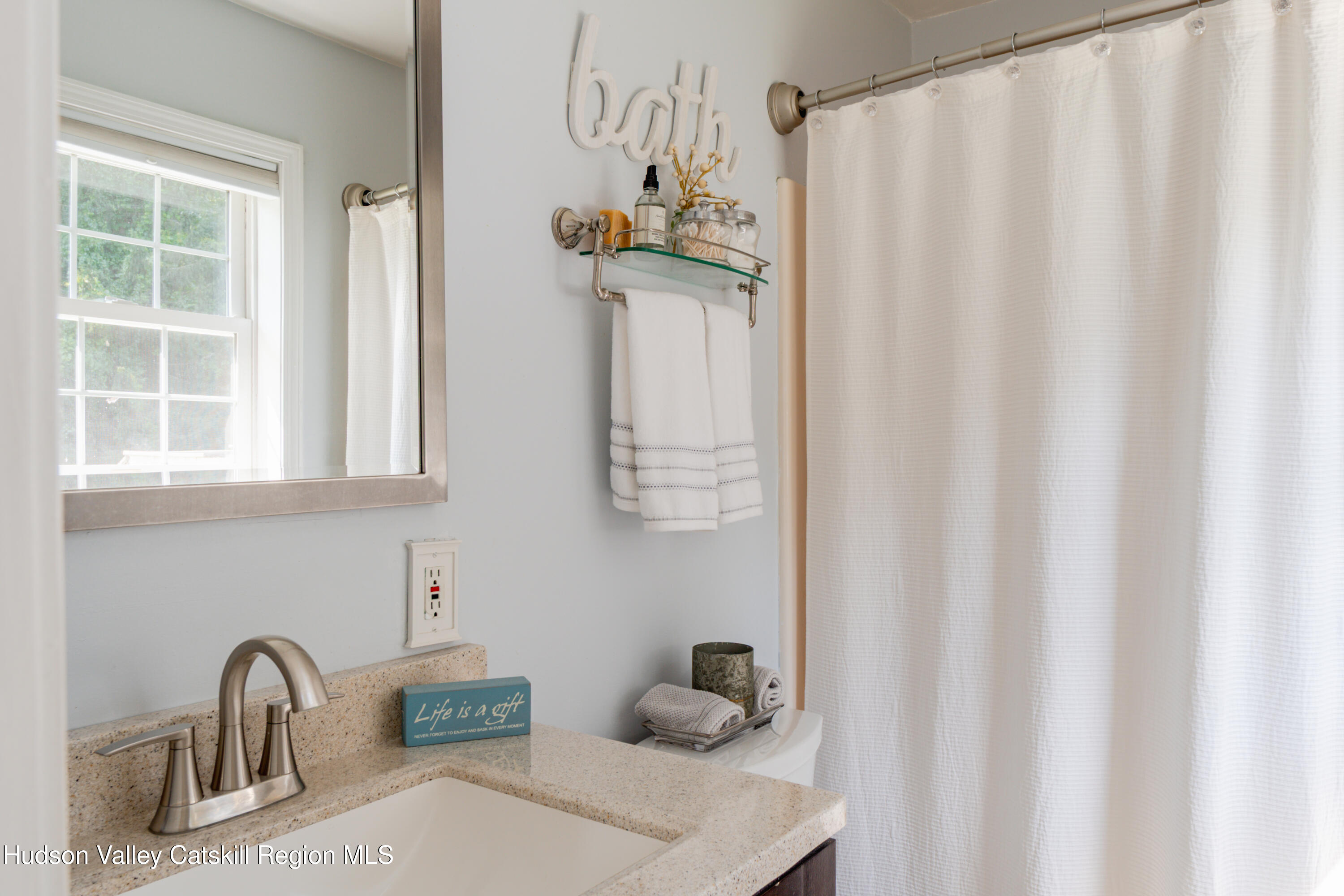 71 Duck Pond Road Stone Ridge, NY 12484 - Photo 16 of 35 a bathroom with a sink and mirror