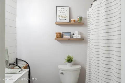 a bathroom with a toilet and a sink