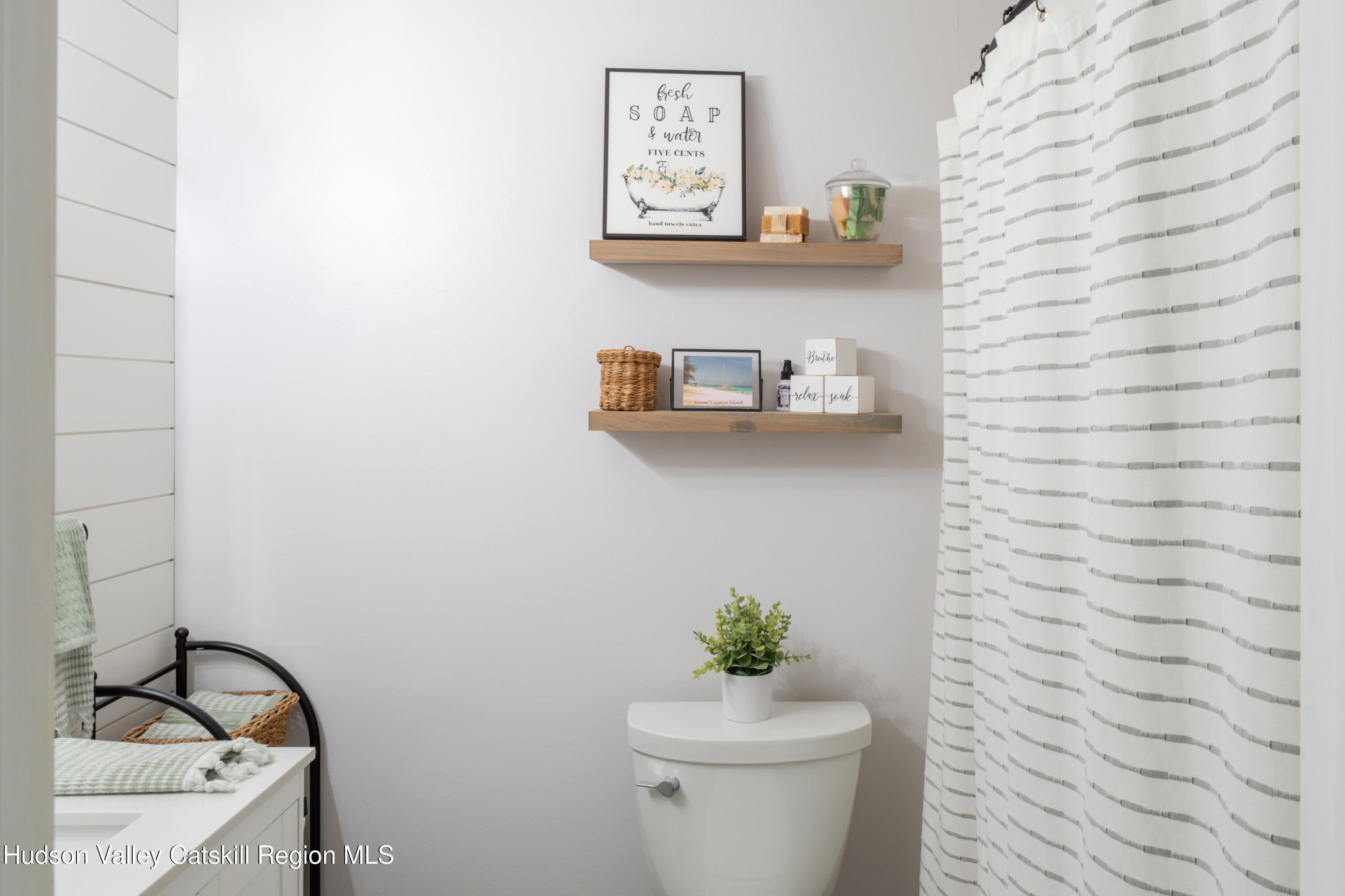 71 Duck Pond Road Stone Ridge, NY 12484 - Photo 21 of 35 a bathroom with a toilet and a sink