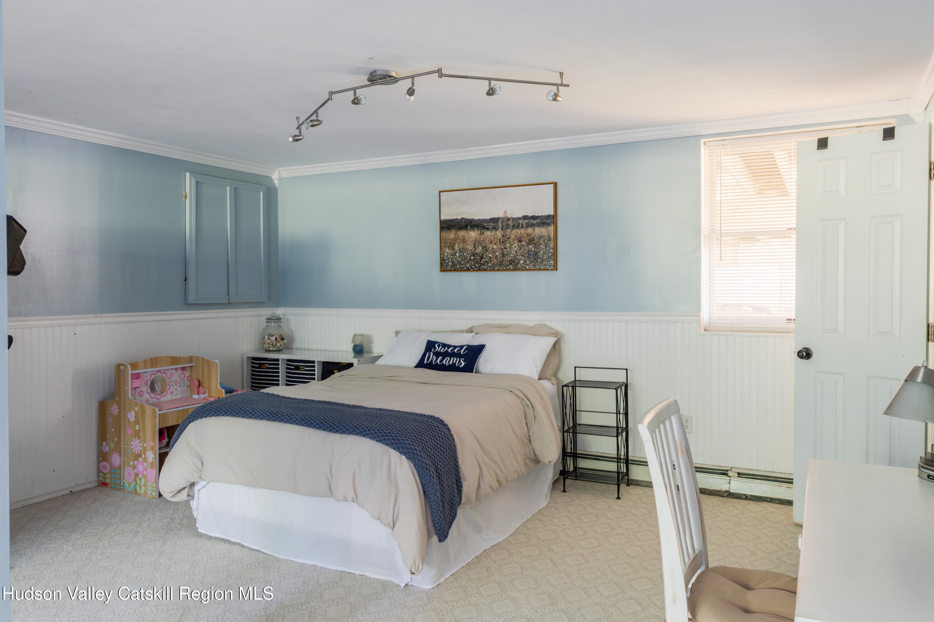 71 Duck Pond Road Stone Ridge, NY 12484 - Photo 26 of 35 a bedroom with a bed and a table