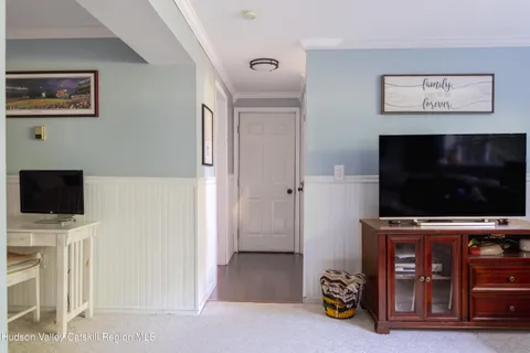 a view of a livingroom with furniture and a flat screen tv