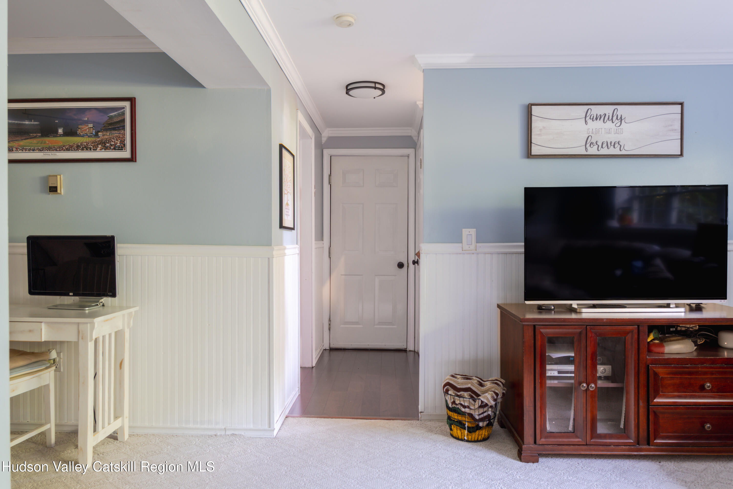 71 Duck Pond Road Stone Ridge, NY 12484 - Photo 27 of 35 a view of a livingroom with furniture and a flat screen tv