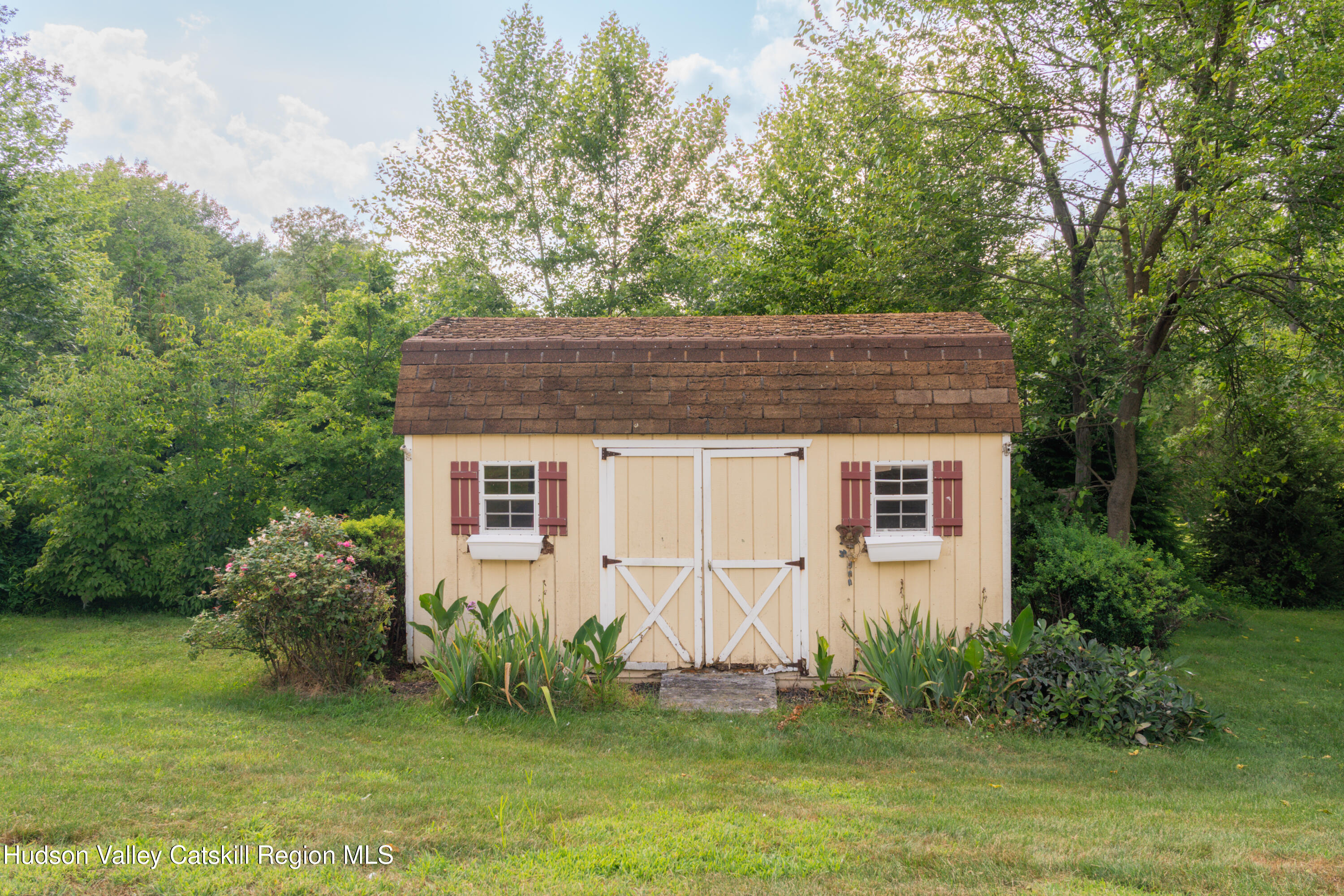 71 Duck Pond Road Stone Ridge, NY 12484 - Photo 32 of 35 a house that has a tree in front of it