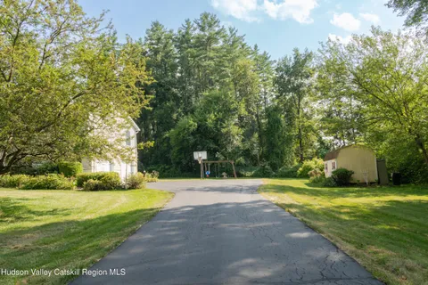 a view of swimming pool with trees