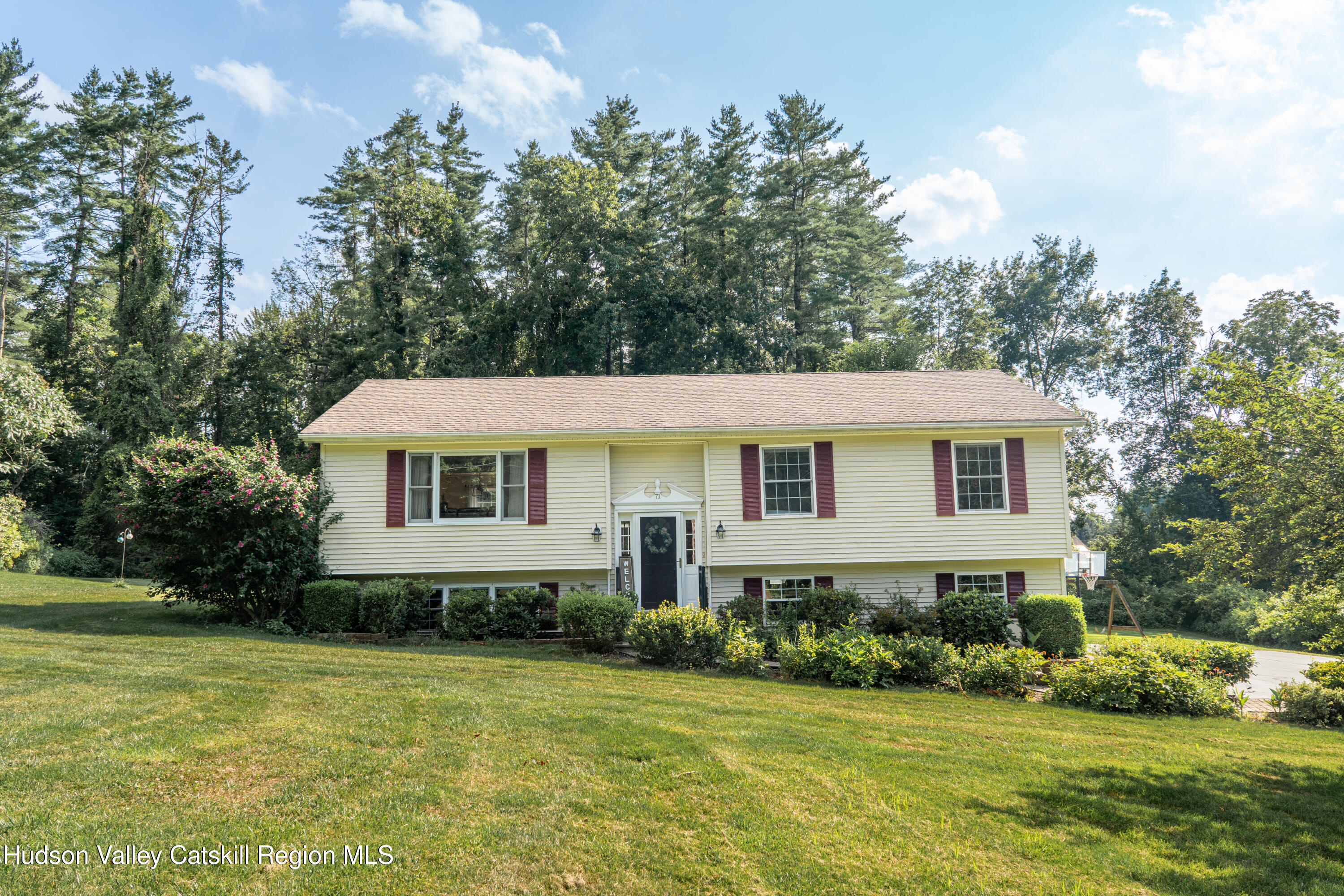 71 Duck Pond Road Stone Ridge, NY 12484 - Photo 34 of 35 a front view of a house with a yard