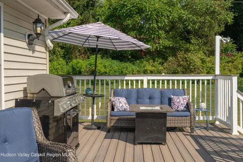 a view of a deck with furniture