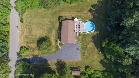 an aerial view of a house with outdoor space swimming pool and outdoor seating