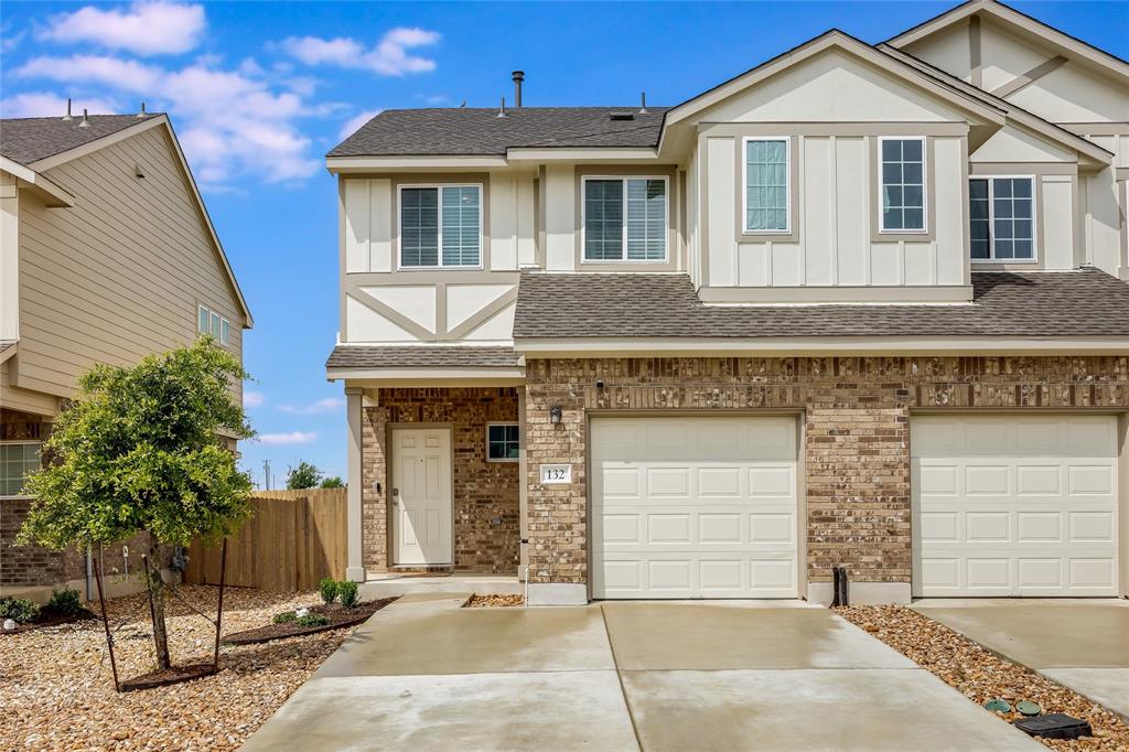 132 Yearling Way Georgetown, TX 78626 - Photo 1 of 21 a front view of a house with a parking area