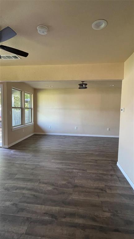 709 East Crafton Street Henrietta, TX 76365 - Photo 9 of 10 a view of empty room with wooden floor
