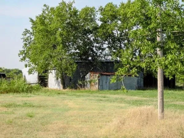 a house with trees in the background