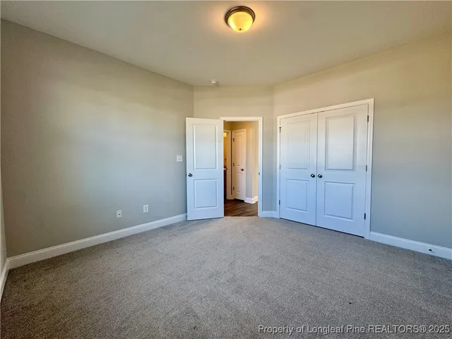 a view of hallway with livingroom