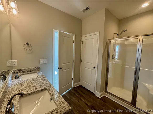 a view of an empty room with a ceiling fan