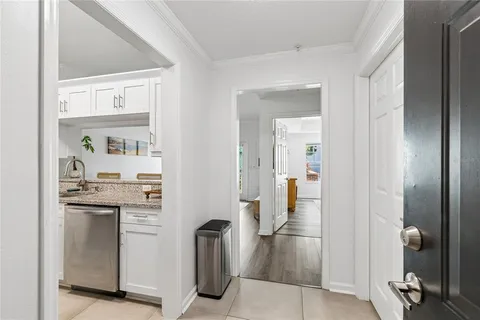 a view of a kitchen from the hallway