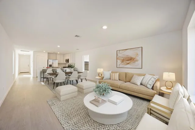 a living room with furniture and a table