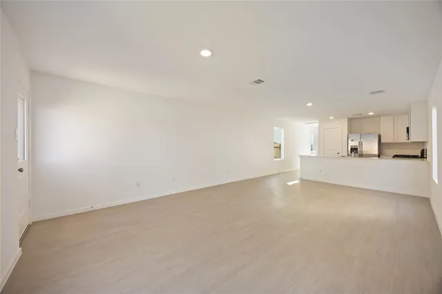 a view of a kitchen with a sink and a stove top oven