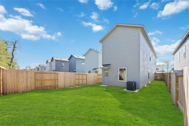 a view of yard with swimming pool and green space