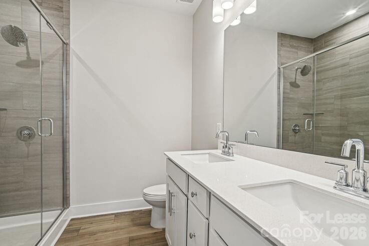 4375 Raleigh Street, Unit C1 Charlotte, NC 28213 - Photo 15 of 19 a bathroom with a sink and a mirror