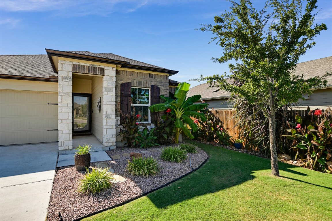 104 Granville Court Jarrell, TX 76537 - Photo 1 of 1 a front view of a house with garden