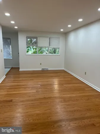 a view of room with wooden floor