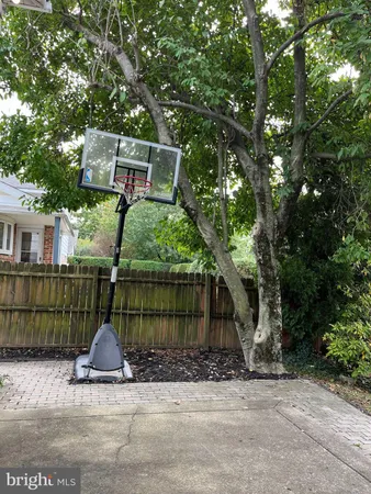 a view of a house with a tree in the background