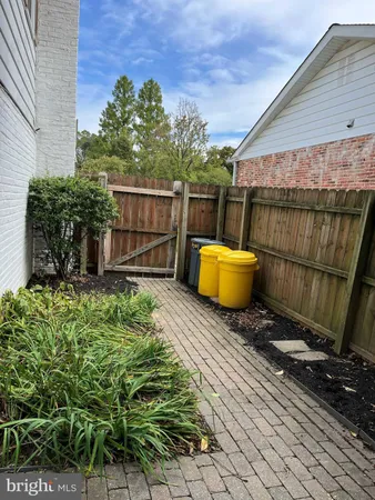 a view of a backyard with sitting area