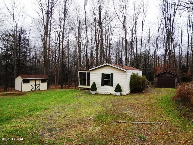 69 Salem Heights Rd Lake Lake Ariel, PA 18436 - Photo 1 of 18 a white house with a big yard and large trees