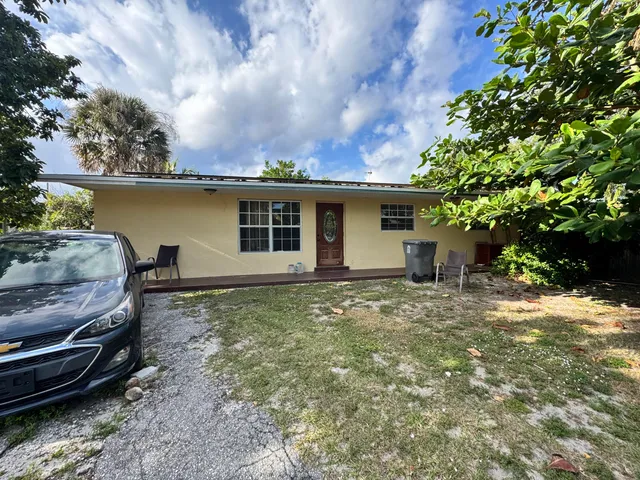 a backyard of a house with lots of green space
