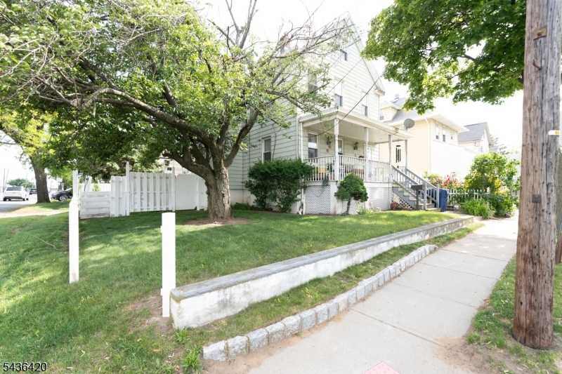 33 Pulaski Place Hackensack, NJ 07601 - Photo 4 of 31 a front view of a house with a yard