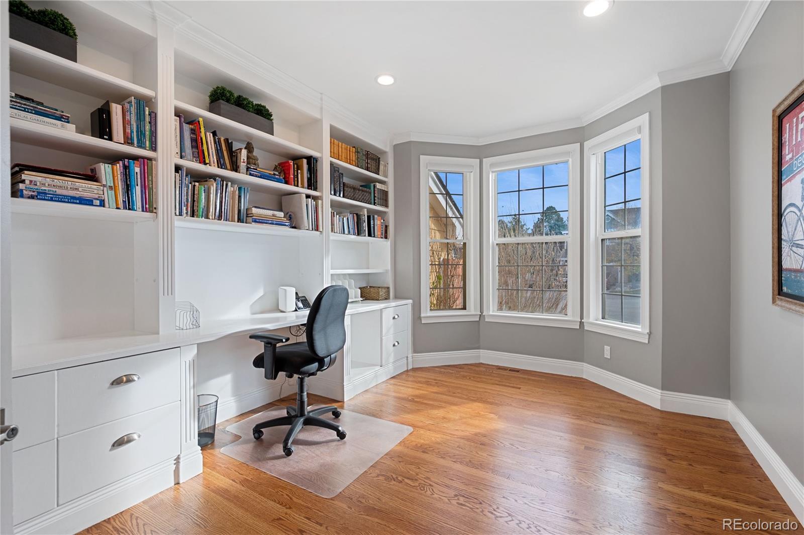 851 Hughes Lane Highlands Ranch, CO 80126 - Photo 14 of 50 a view of a workspace with furniture and a window