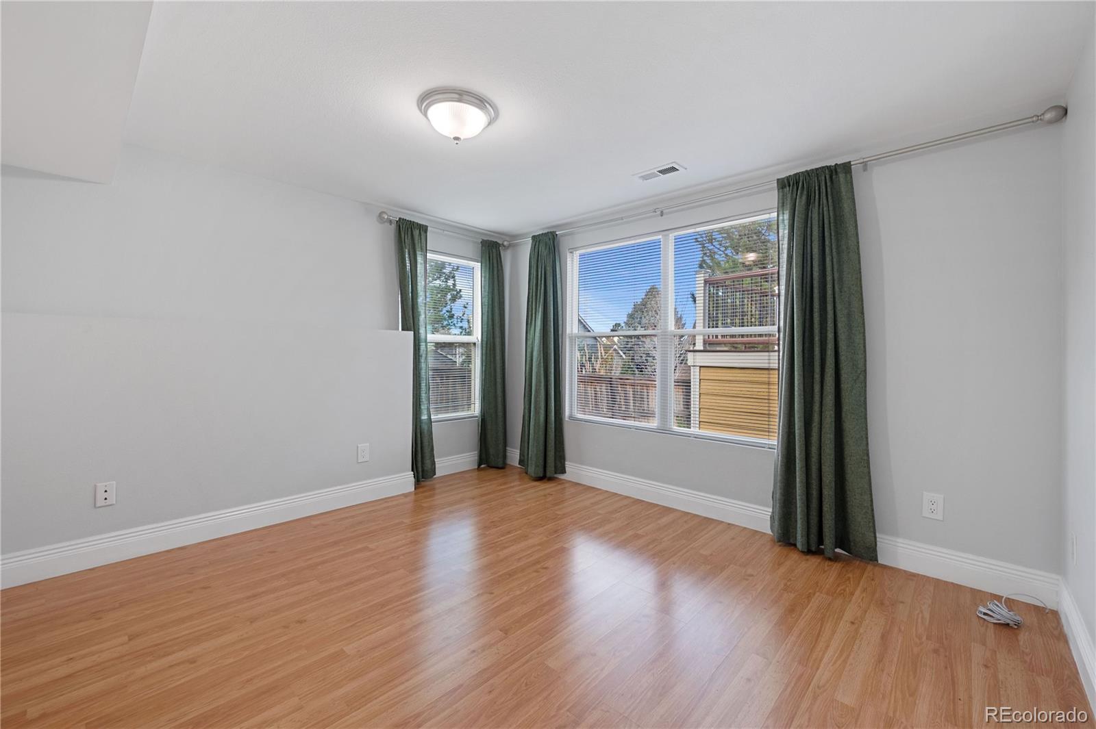 851 Hughes Lane Highlands Ranch, CO 80126 - Photo 35 of 50 a view of an empty room with glass door