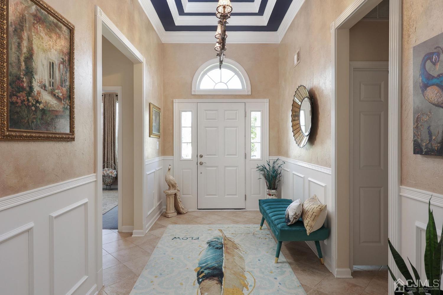 170 Tournament Drive Monroe Township, NJ 08831 - Photo 11 of 36 a living room with furniture and a chandelier