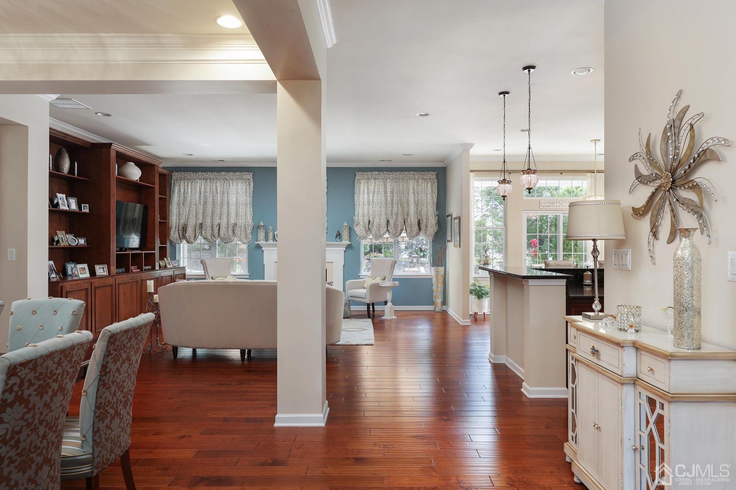170 Tournament Drive Monroe Township, NJ 08831 - Photo 14 of 36 a living room with couches chairs and kitchen view with wooden floor