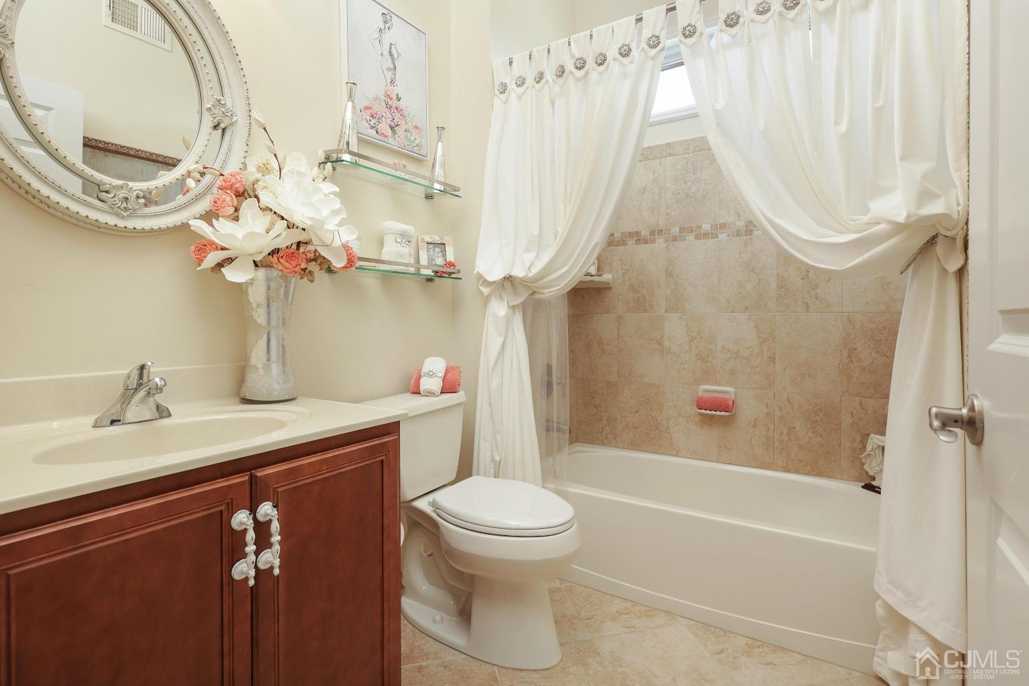 170 Tournament Drive Monroe Township, NJ 08831 - Photo 16 of 36 a bathroom with a sink a toilet and a bathtub